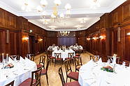 Festively decorated banquet hall with wood pannelling